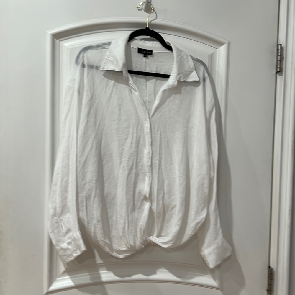 Talent 65% viscose 35% polyester plus size button down shirt with twisted front.
